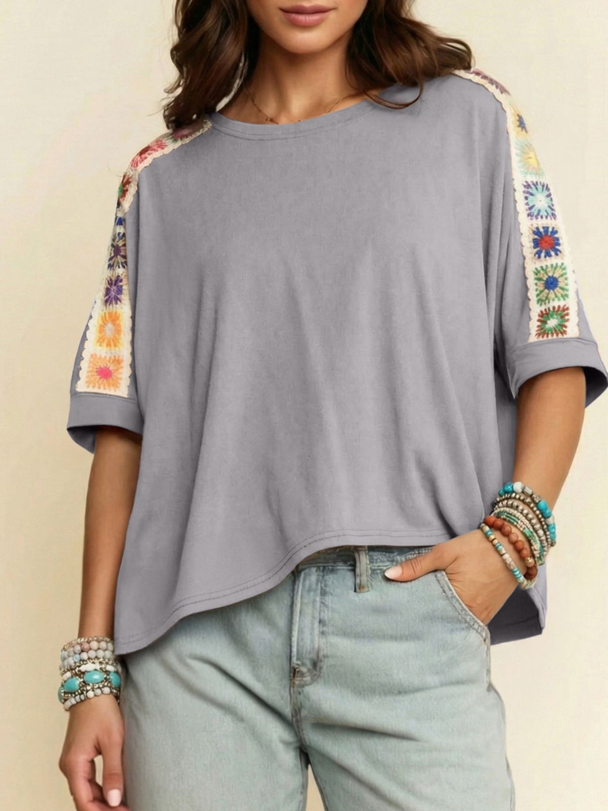 Square crochet detail loose T-shirt from Trendsi, featuring a relaxed fit and crochet accents in a casual blouse style.