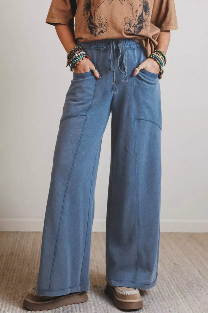 Relaxed fit drawstring jeans by Trendsi, showing light-wash denim with a relaxed silhouette and adjustable waistband.