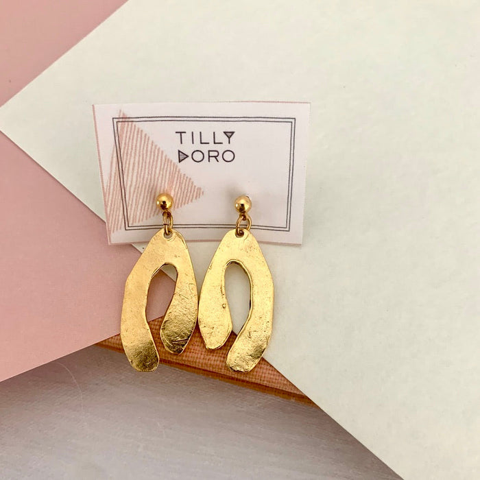 Tillydoro inlet earrings featuring sleek, modern design with polished metal finish, displayed on a neutral background.