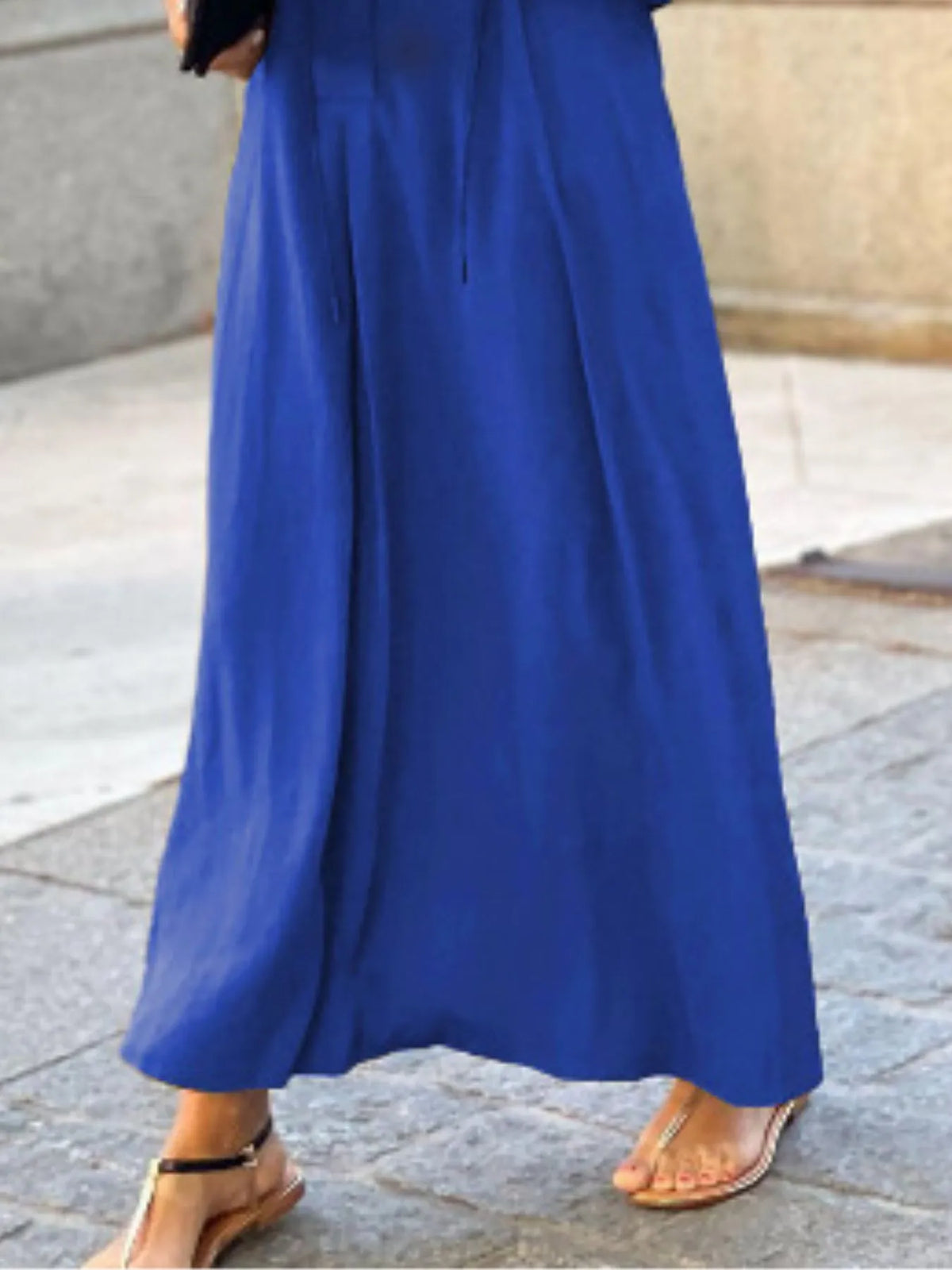 Trendsi solid color maxi shirt dress featuring a relaxed fit and button-down front, styled with rolled sleeves.