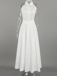 Backless button-front maxi dress by Trendsi featuring a flowing silhouette and elegant design, shown in a stylish fabric.