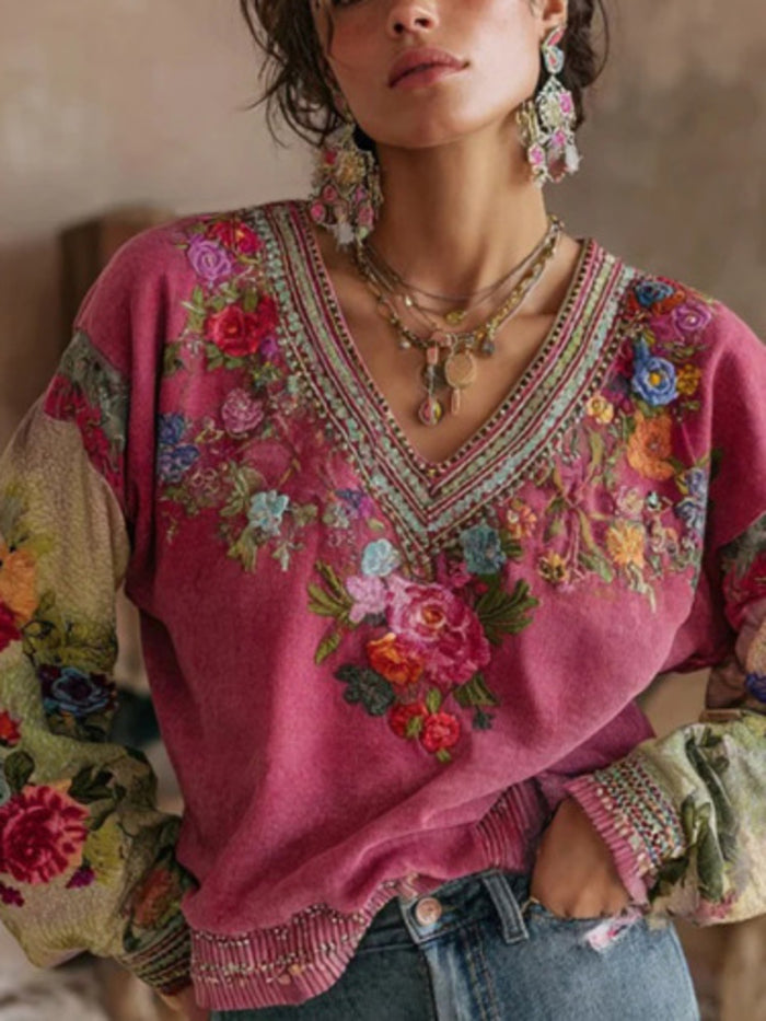 Floral embroidered V-neck blouse from Trendsi featuring colorful embroidery on lightweight fabric.