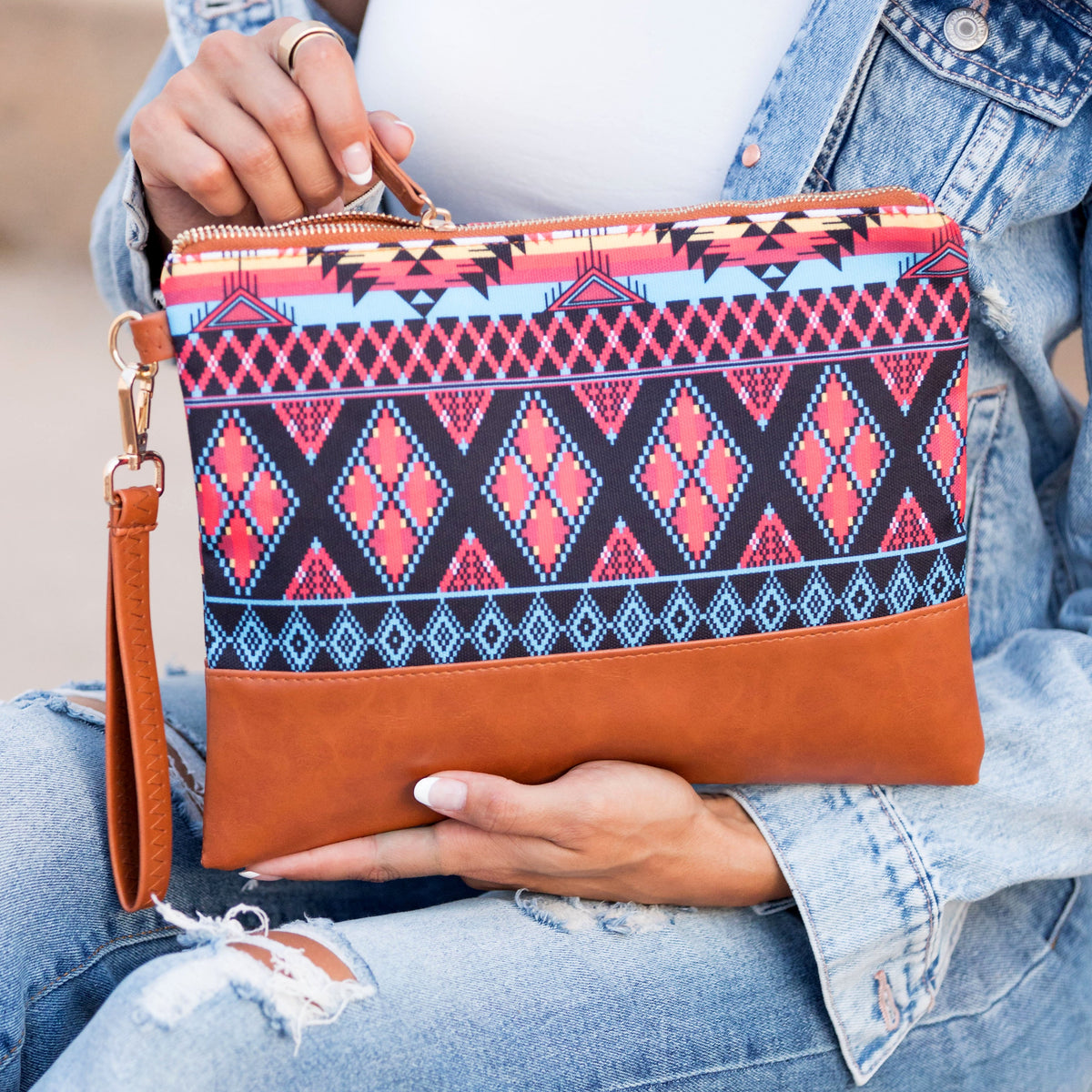 Aili's Corner Aztec Boho clutch bag with colorful geometric patterns and tassel details, stylish accessory for casual or evening wear.