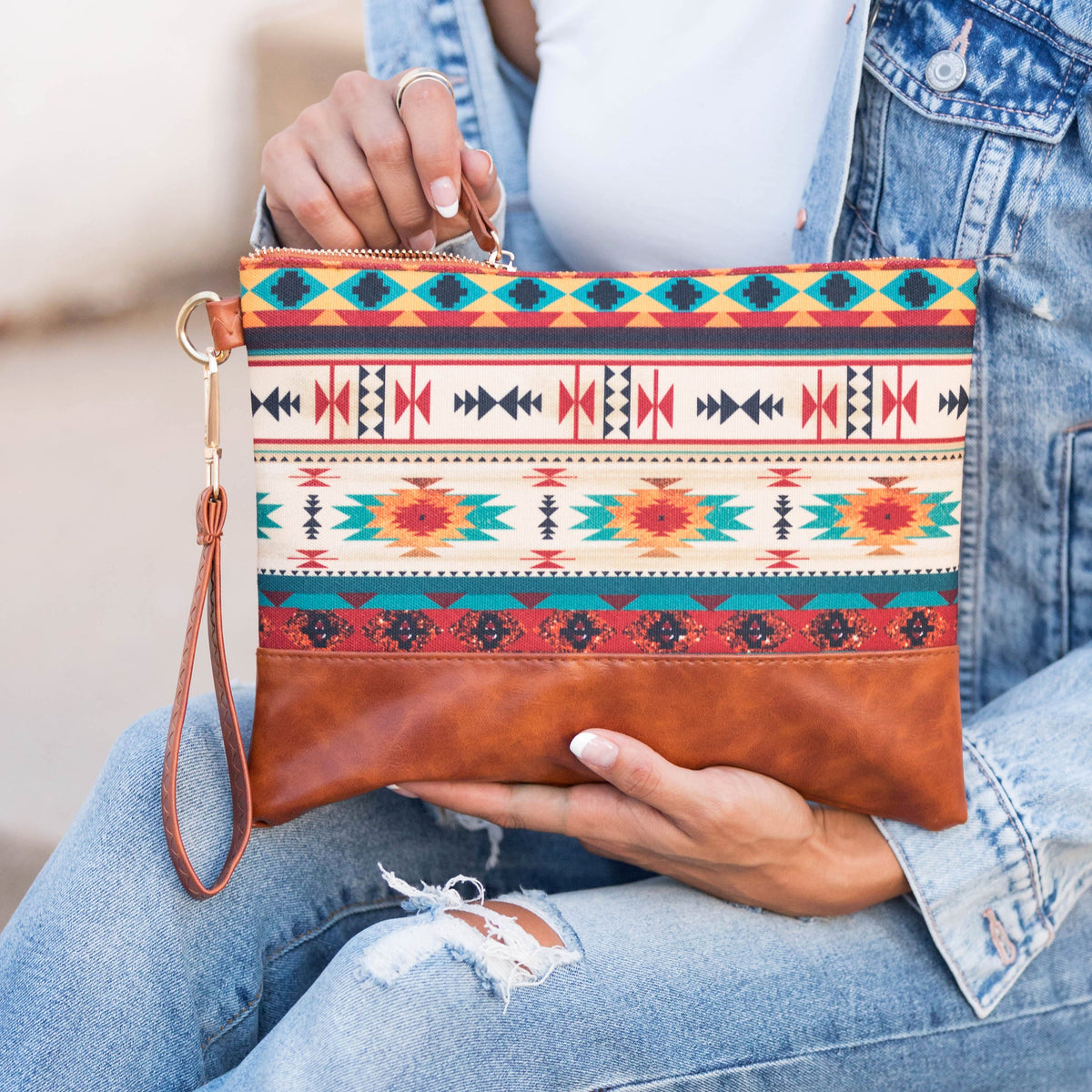 Aili's Corner Aztec Boho clutch bag with colorful geometric pattern and tassel detail for stylish accessories.