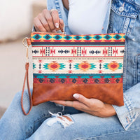 Aili's Corner Aztec Boho clutch bag with colorful geometric pattern and tassel detail for stylish accessories.