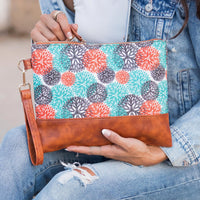 Aili's Corner Aztec Boho clutch bag with colorful geometric pattern and leather wrist strap, perfect for casual or boho style accessories.
