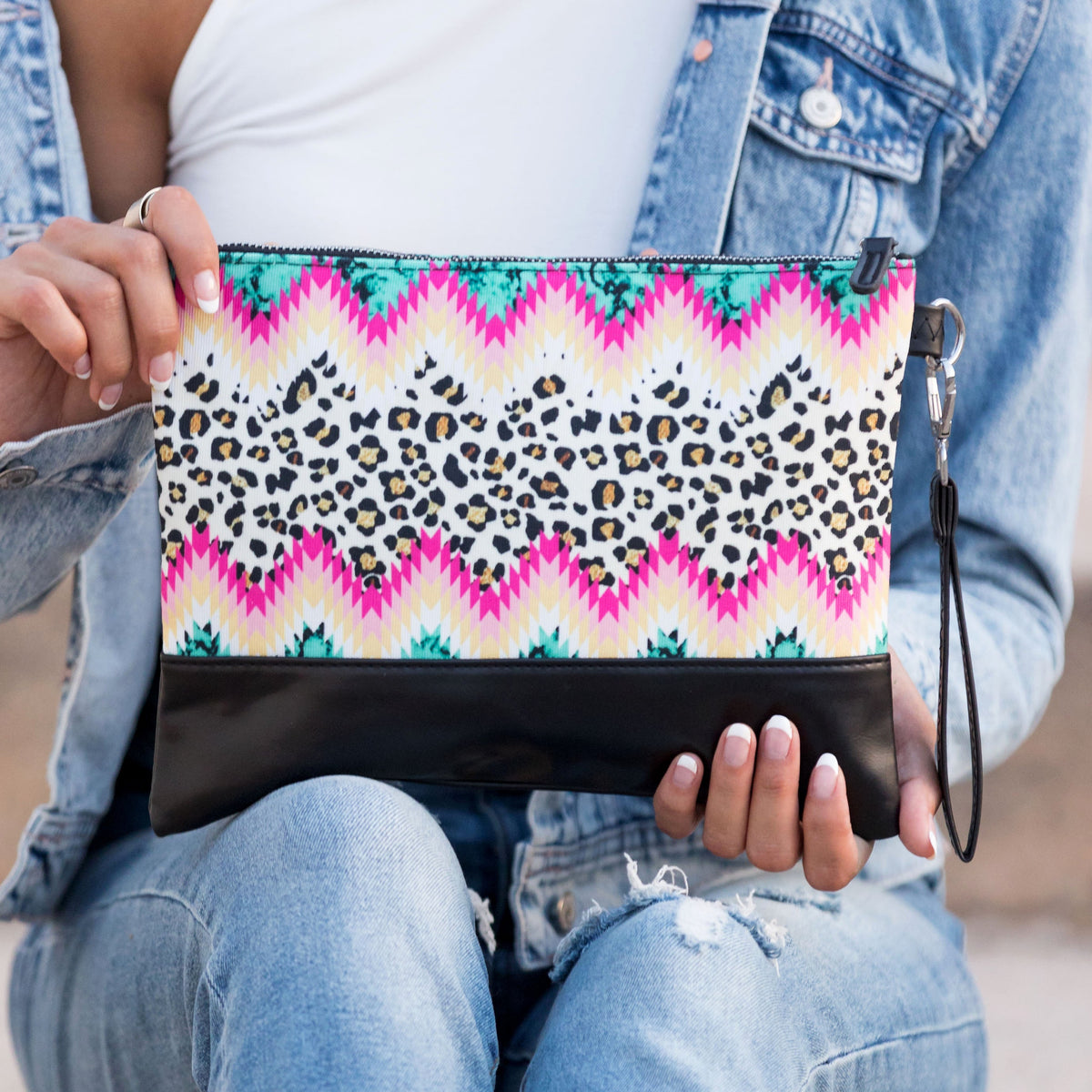 Aili's Corner Aztec Boho clutch bag with colorful geometric patterns and a zipper closure, perfect for casual or bohemian style.