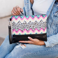 Aili's Corner Aztec Boho clutch bag with colorful woven pattern and zip closure, perfect for casual or bohemian style.