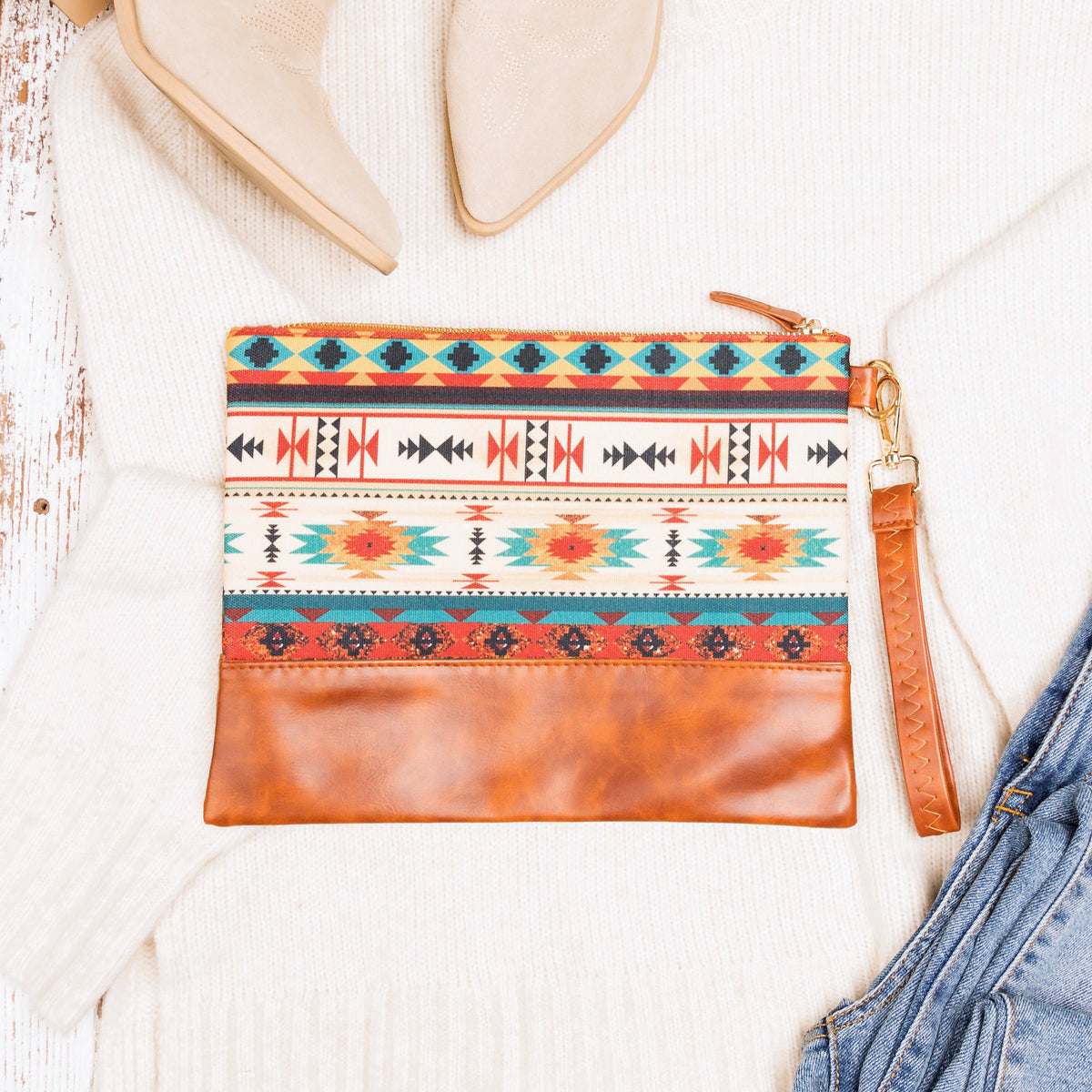 Aili's Corner Aztec Boho clutch bag featuring colorful woven patterns and a zip closure, perfect for casual or bohemian style.