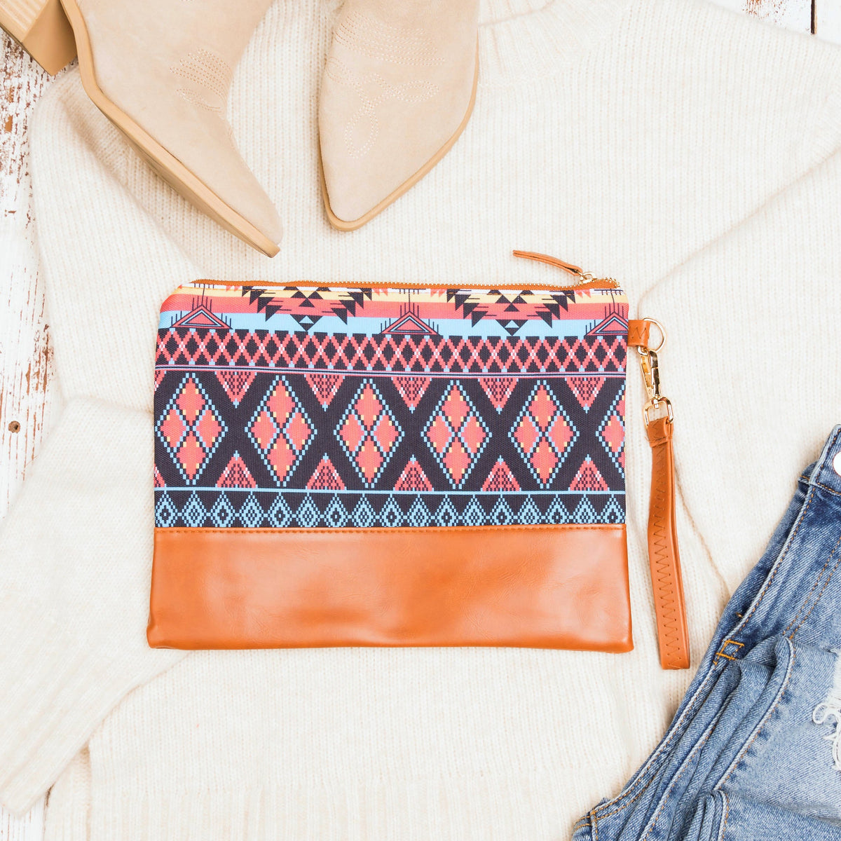 Aili's Corner Aztec Boho clutch bag with colorful geometric patterns and tassel accents, perfect for casual or bohemian style.