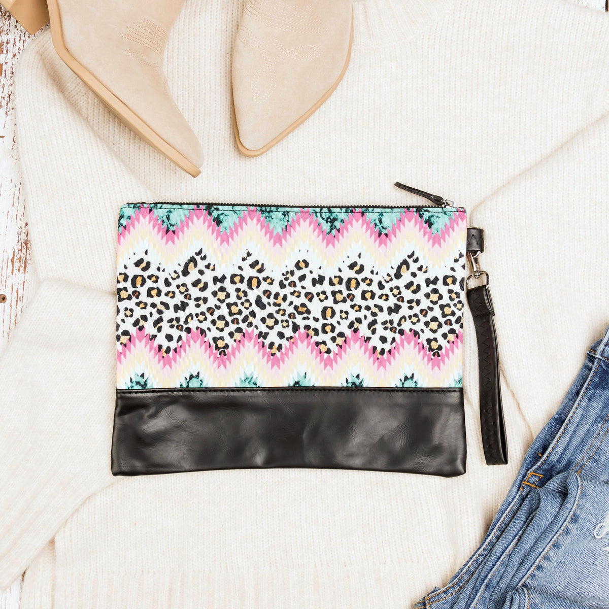 Aili's Corner Aztec Boho clutch bag with colorful woven pattern and leather accents, stylish accessory for casual or boho outfits.