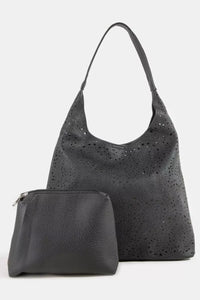 Trendsi Fame shoulder bag with intricate cutout motif, stylish handbag accessory featuring detailed design and structured shape.