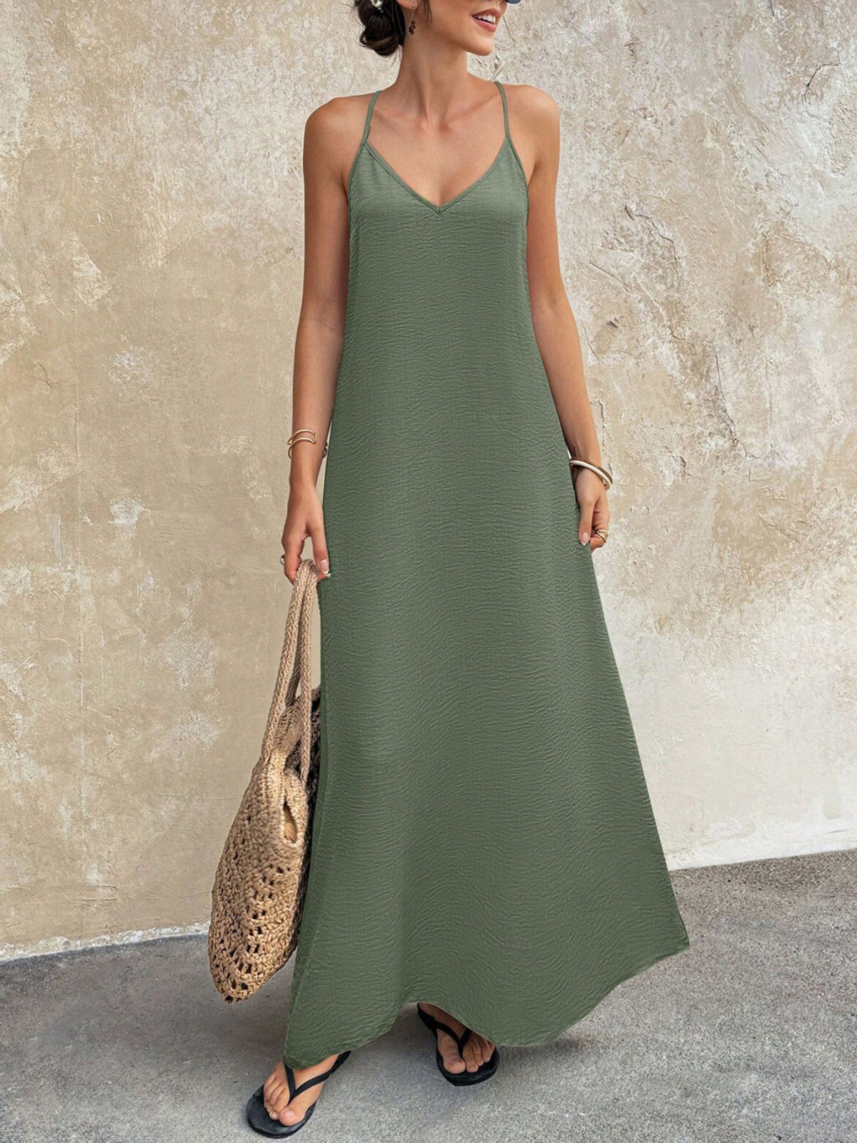 V-neck maxi cami dress from Trendsi featuring a flowy silhouette and sleeveless design, perfect for casual or summer wear.