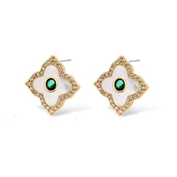 Gold-plated quatrefoil pendant and earrings with white enamel, emerald CZ center stones, and crystal borders on white background.