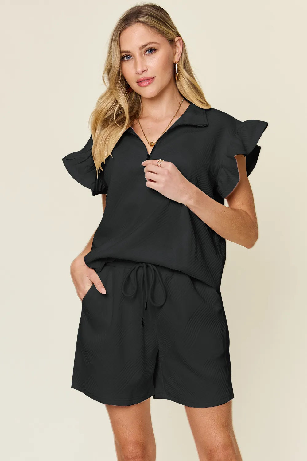 Trendsi Double Take texture flounce sleeve top and drawstring shorts two-piece set, casual stylish outfit for warm weather.