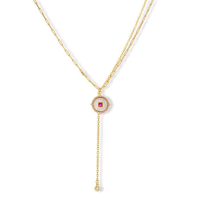 Gold-plated circular medallion necklace set with white enamel base and pink cubic zirconia accent stones
