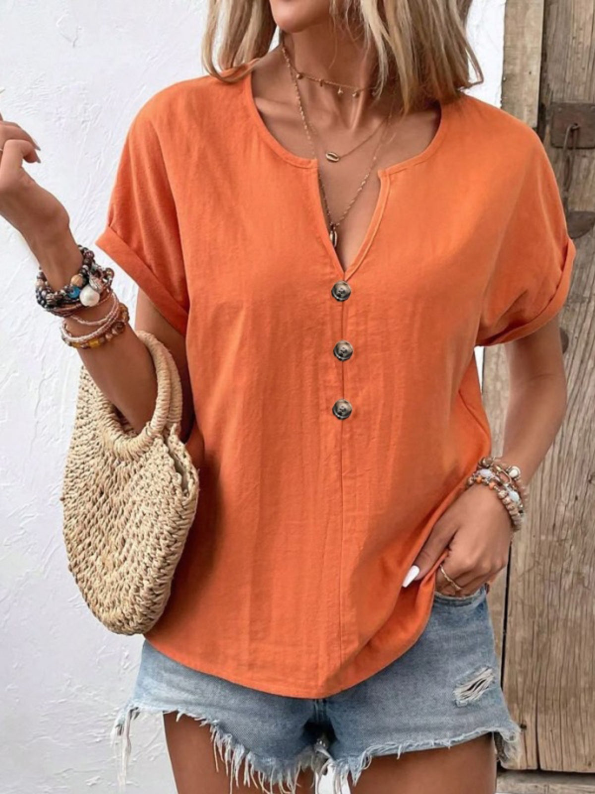Trendsi notched short sleeve blouse in soft fabric, featuring a relaxed fit and stylish neckline detail.