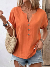 Trendsi notched short sleeve blouse in soft fabric, featuring a relaxed fit and stylish neckline detail.