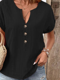 Notched short sleeve blouse by Trendsi, featuring a relaxed fit and stylish design in a soft fabric.