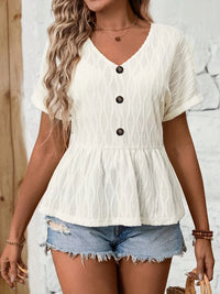 V-neck blouse by Trendsi featuring decorative buttons, lightweight fabric, and stylish design, perfect for casual or office wear.