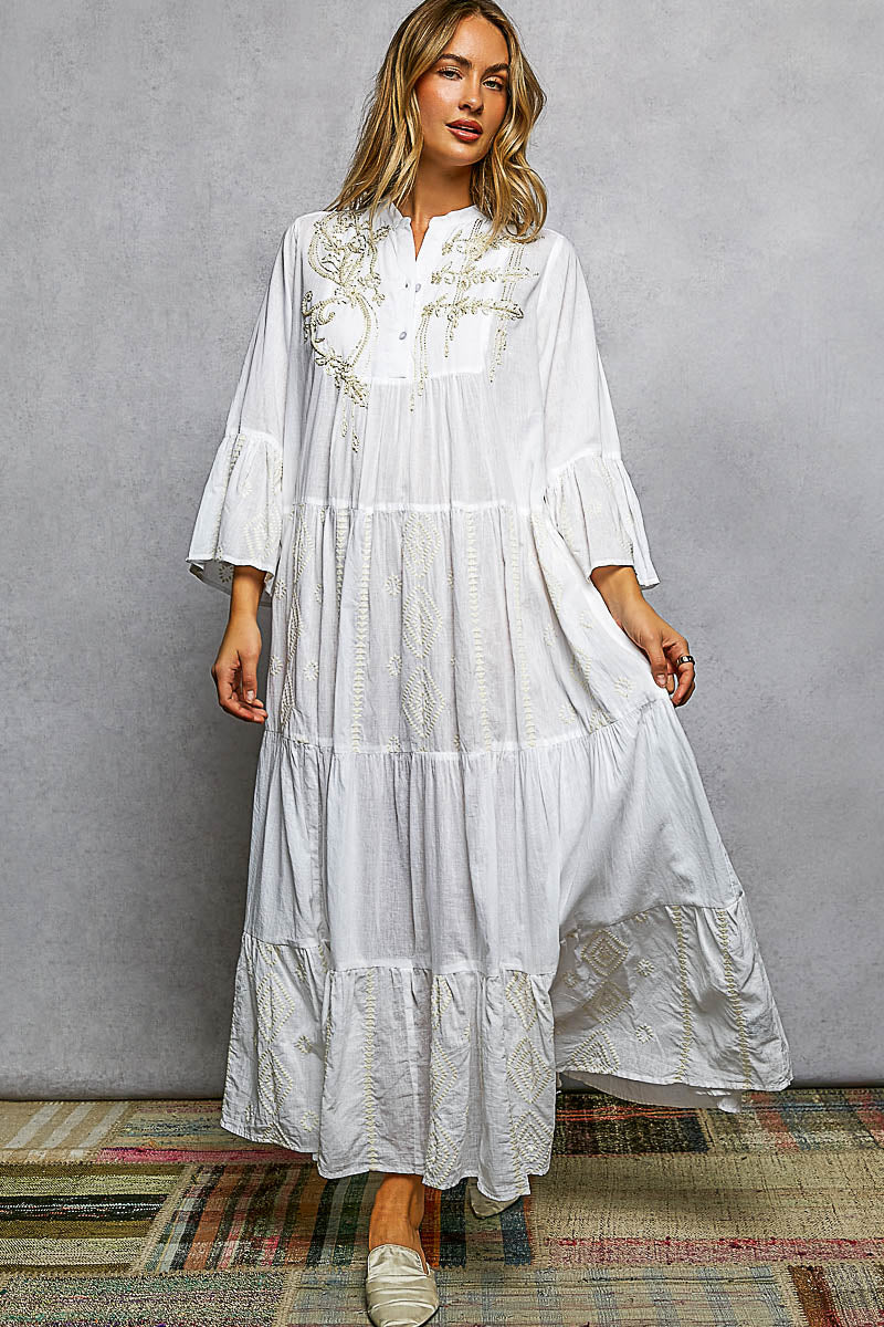 Embroidered floral tiered maxi dress by Trendsi featuring a flowy silhouette and intricate floral embroidery on lightweight fabric.