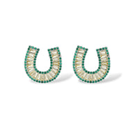 Sparkling horseshoe-shaped jewelry set with AAA cubic zirconia in gold-plated and white gold finishes on cream background.