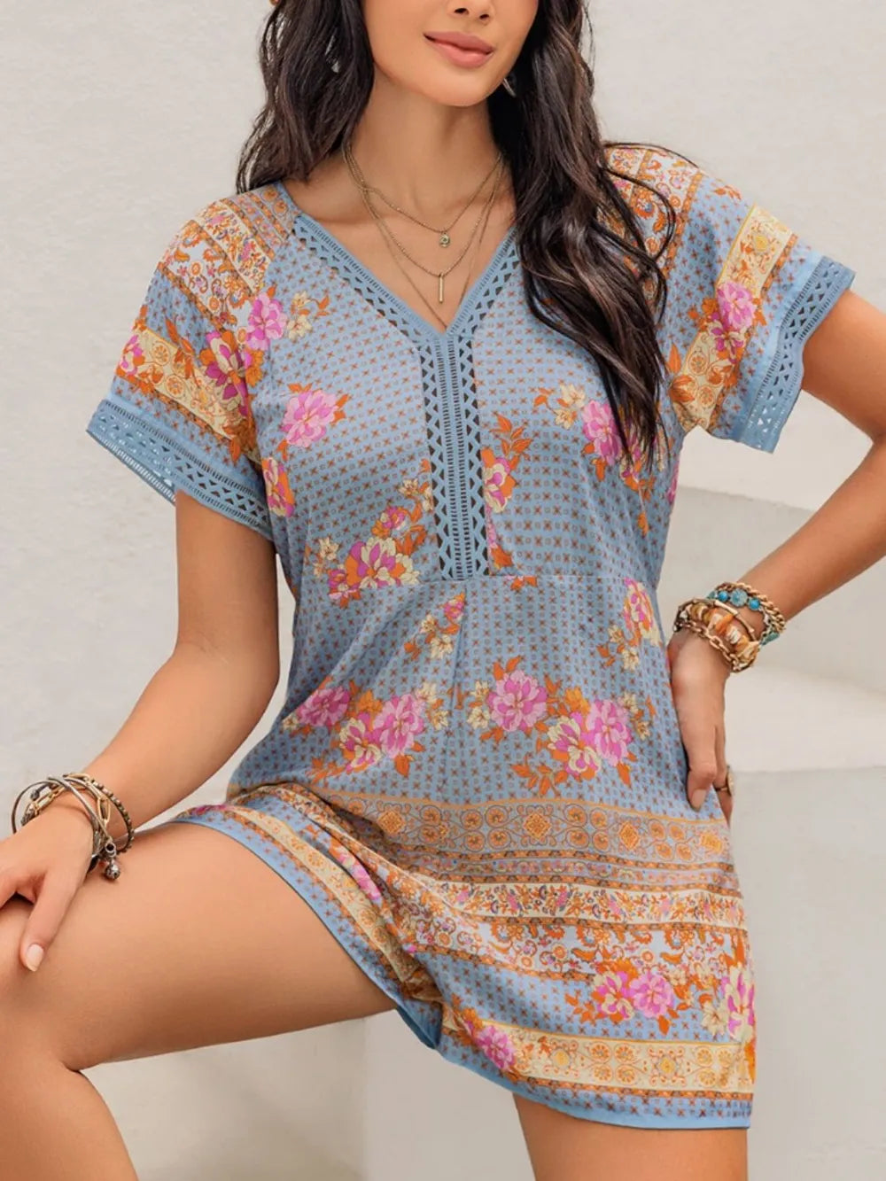 Printed cutout romper from Trendsi, stylish jumpsuit featuring bold patterns and cutout details, ideal for casual or summer wear.