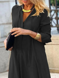 Trendsi solid color maxi shirt dress with a relaxed fit and button-down front, displayed on a hanger.