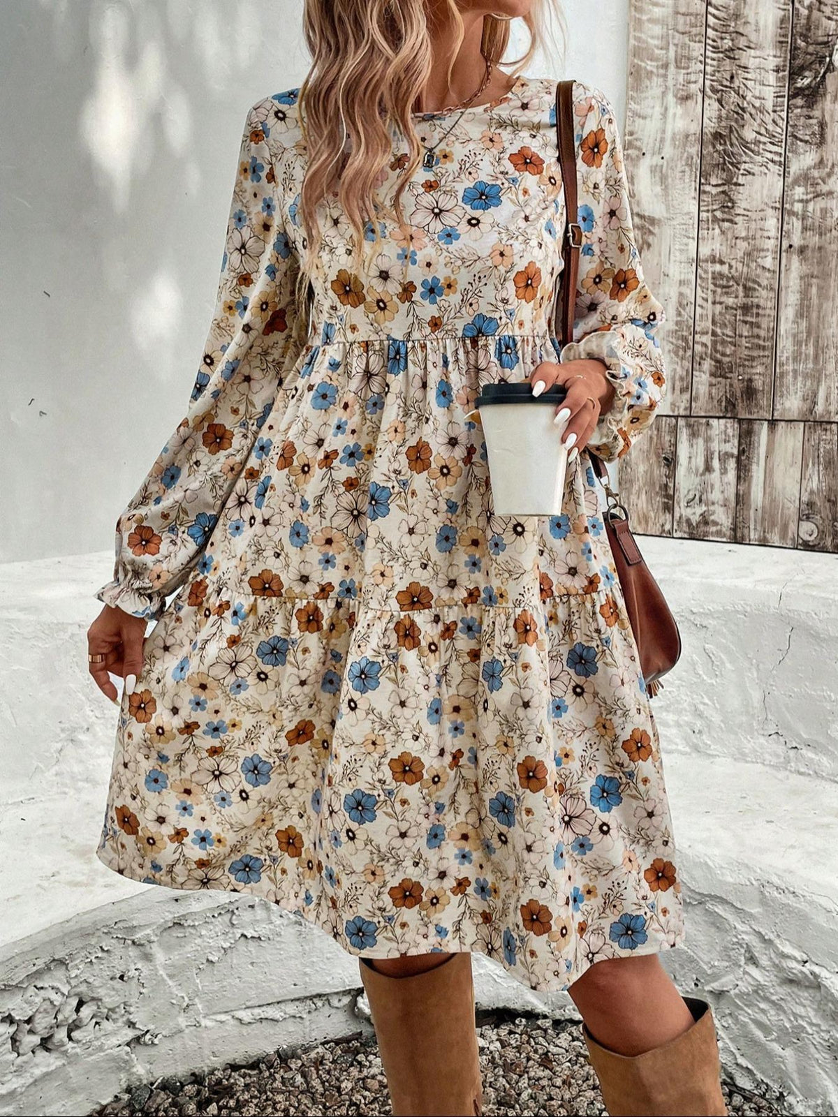 Floral print long sleeve tiered dress from Trendsi, featuring a flowy silhouette and vibrant flower patterns.