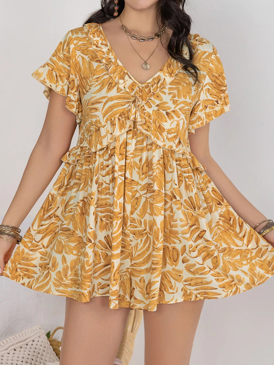 Trendsi ruffled print romper with a stylish design, featuring ruffle details and a vibrant pattern, perfect for casual wear.