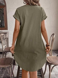 Casual button-down short sleeve dress from Trendsi, featuring a relaxed fit and lightweight fabric, with a collar and front buttons.