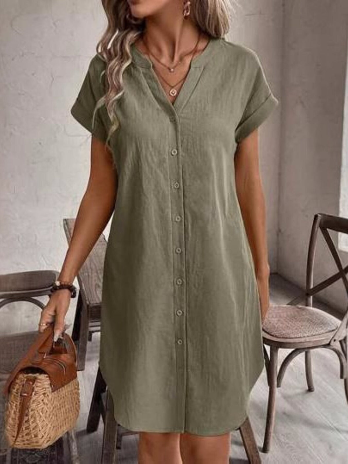 Casual button-down short sleeve dress by Trendsi, featuring a relaxed fit and stylish design, shown on a model.