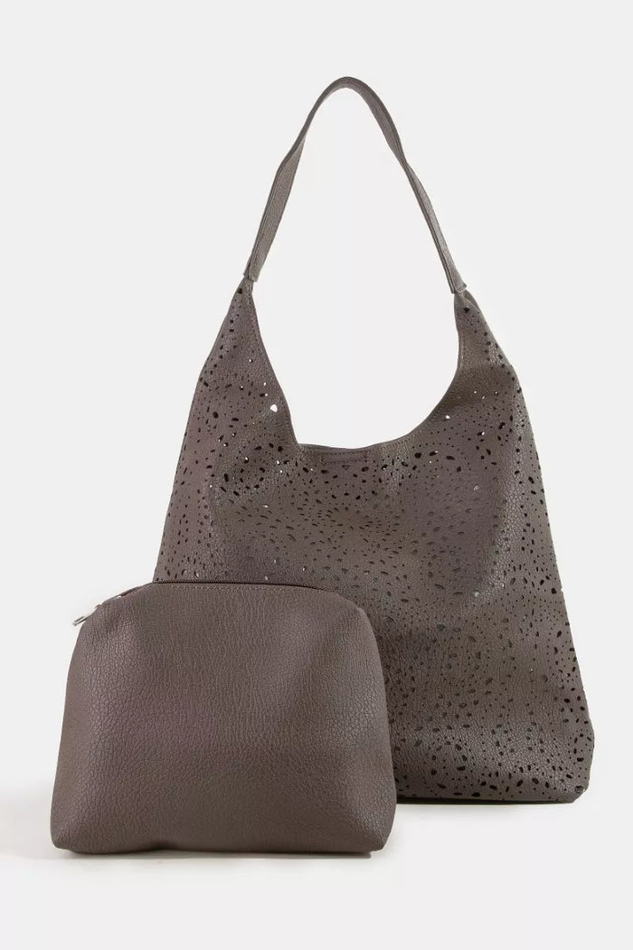 Fame Intricate Cutout Motif shoulder bag by Trendsi, featuring detailed cutouts and a stylish design for handbag accessories.
