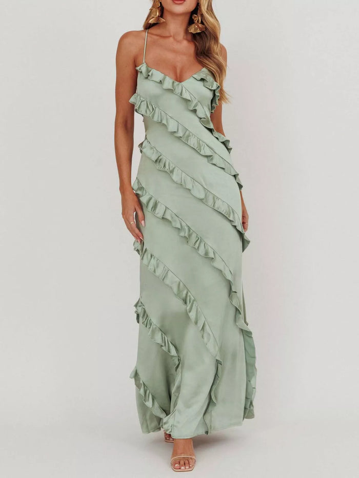 Ruffled spaghetti strap maxi dress from Trendsi featuring flowing fabric and a stylish design, perfect for summer or special occasions.