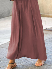 Trendsi solid color maxi shirt dress featuring a relaxed fit and button-down design, ideal for casual outings.