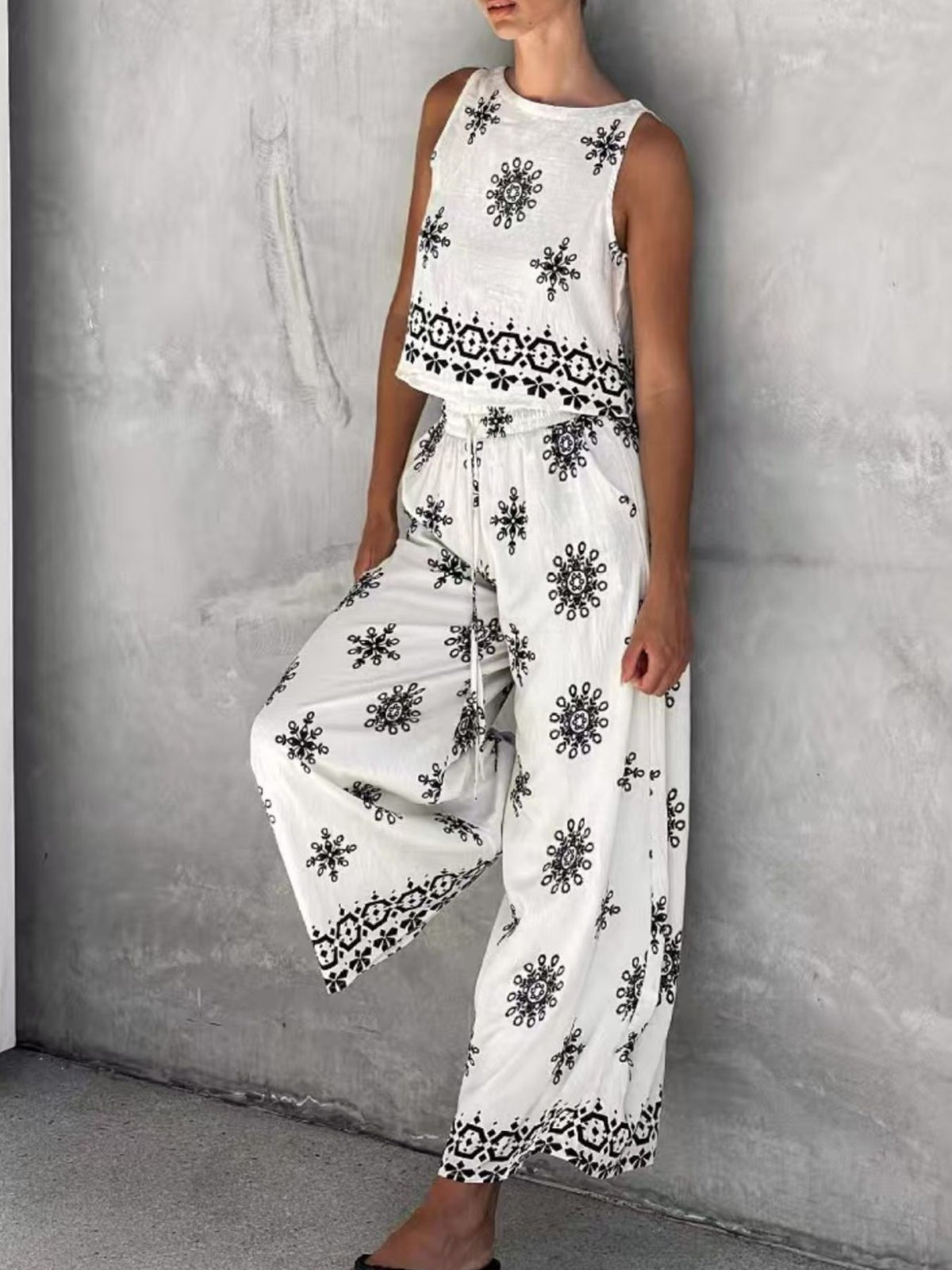 Trendsi sleeveless top and wide-leg pants set, two-piece outfit featuring a sleeveless blouse and flowy trousers in a stylish design.