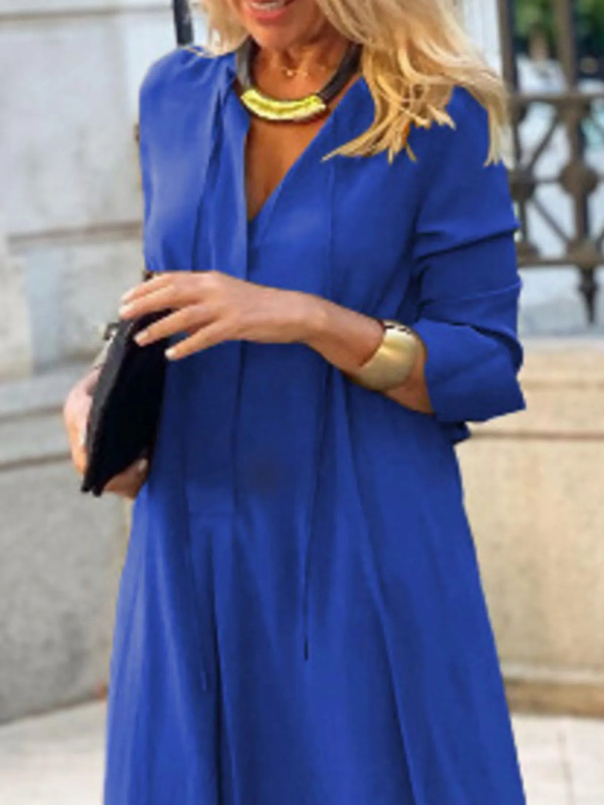 Trendsi solid color maxi shirt dress featuring a relaxed fit and button-down front, perfect for casual or semi-formal wear.