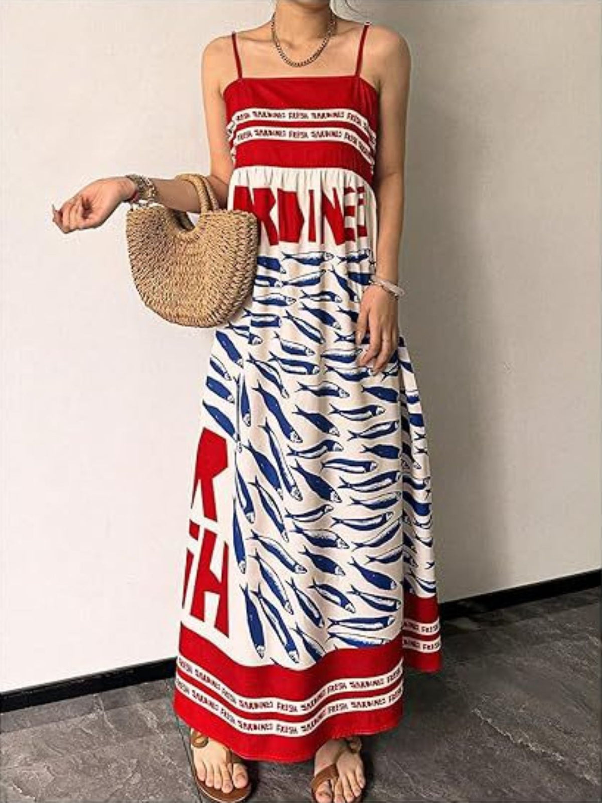 Sardine print spaghetti strap maxi dress by Trendsi, flowing dress with bold fish pattern and thin straps, perfect for summer wear.