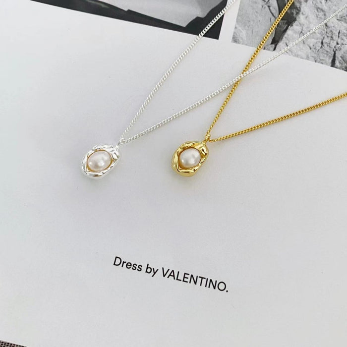 Sterling silver pearl pendant necklace with a delicate chain, featuring a lustrous pearl at the center, stylish and elegant jewelry piece.