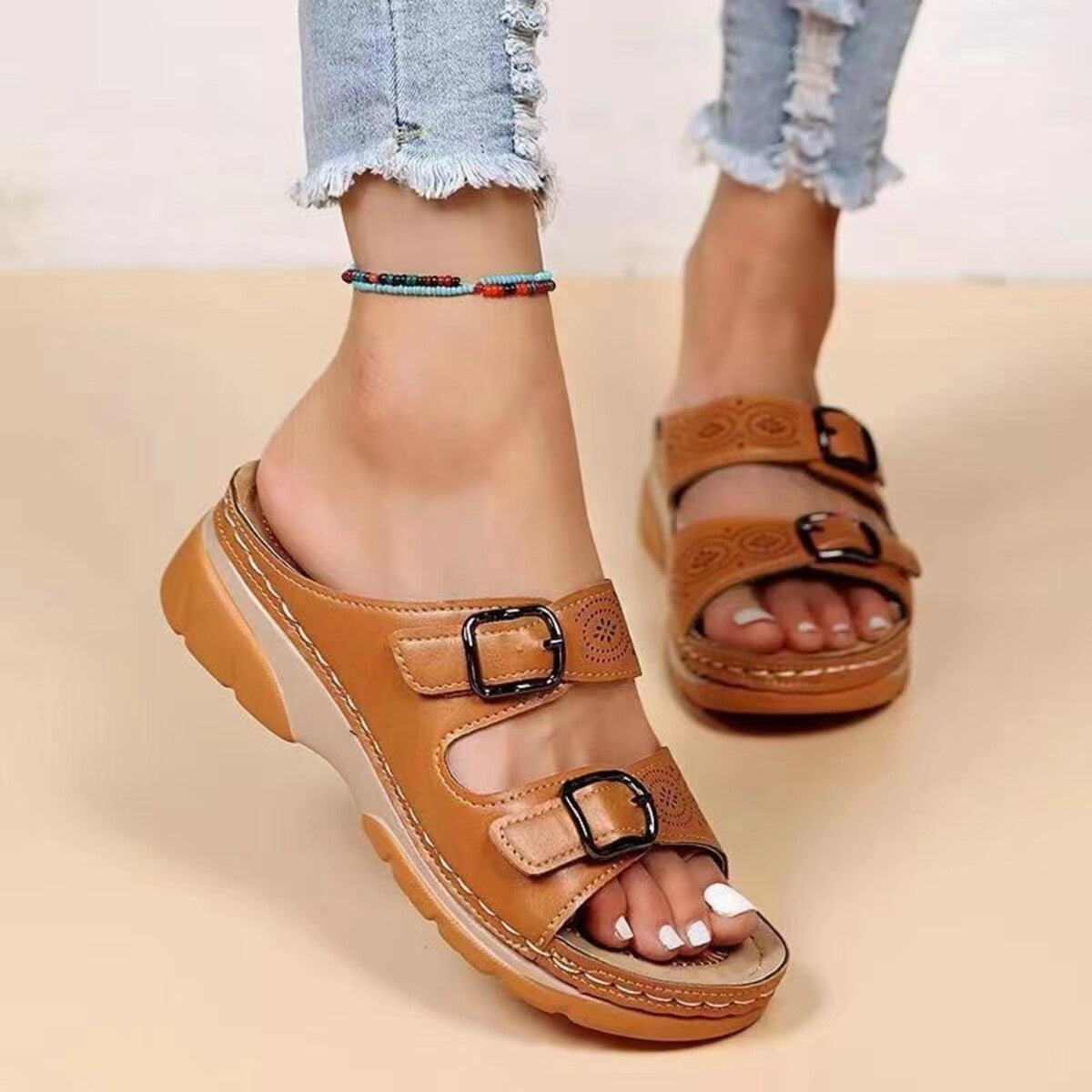 Trendsi double buckle open toe sandals showing tan leather straps and silver buckles on a neutral background