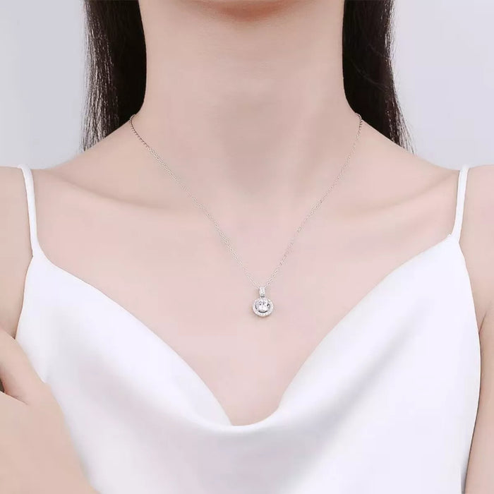 Sterling silver pendant necklace with 1 carat moissanite gemstone, elegant jewelry piece, shiny silver chain with gemstone centerpiece.