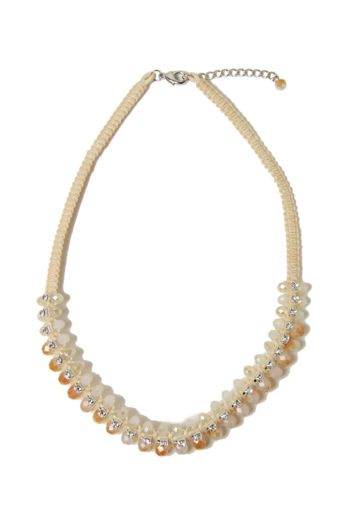 SAACHI Gabrielle Peach Necklace featuring a delicate chain and peach-colored pendant, showcasing elegant jewelry design.