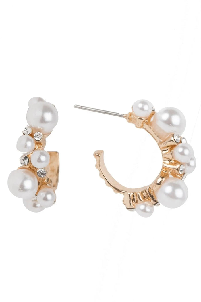 Elegant SAACHI multi pearl hoop earrings featuring multiple pearl accents on gold-tone hoops.