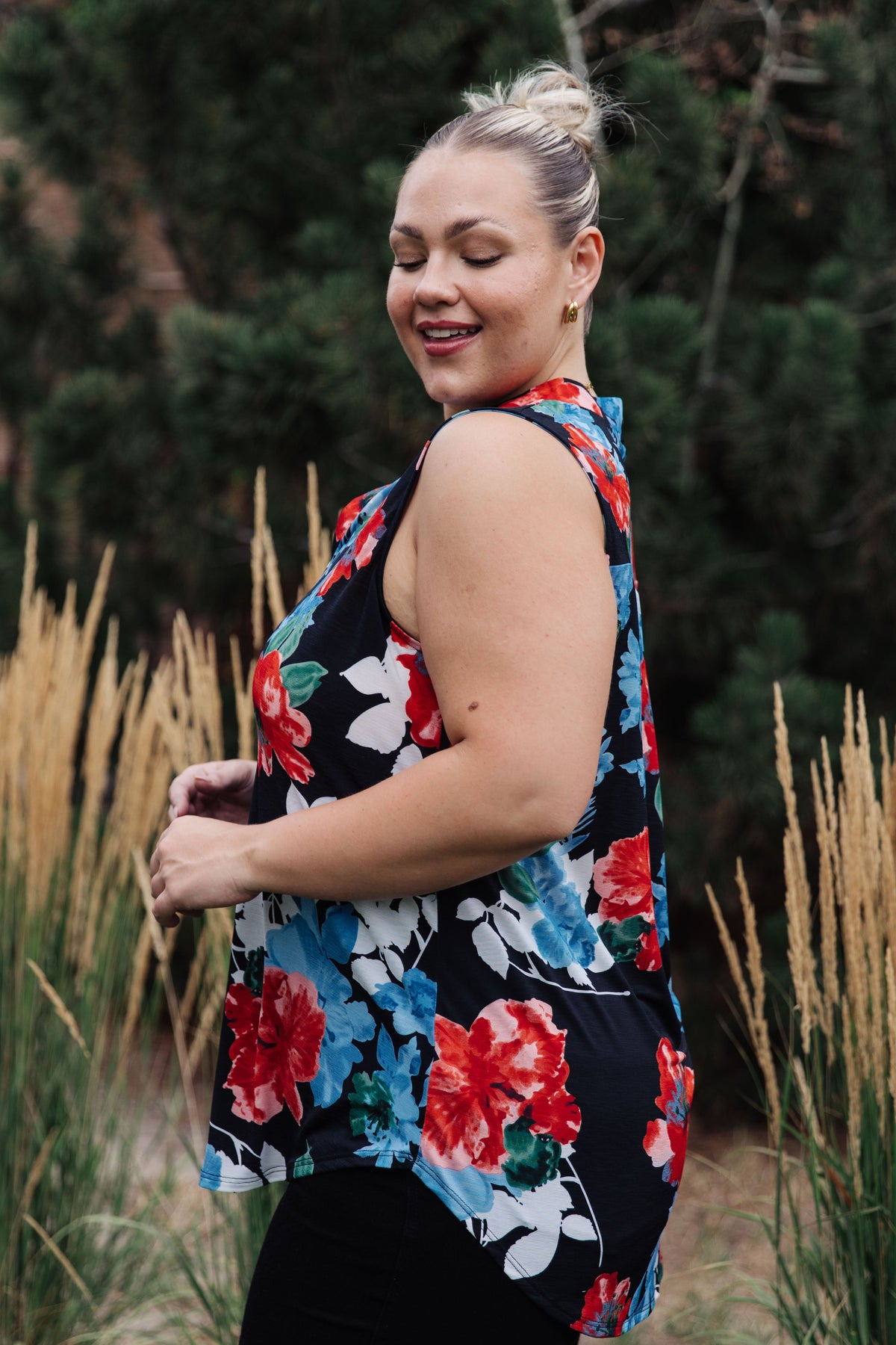 A sleeveless blouse by Ave Shops featuring a floral rose pattern, stylish and casual for warm weather wear.