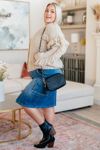 Pregúntame sobre el cárdigan con flecos