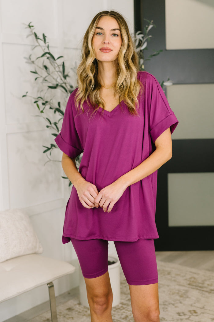 Womens buttery soft V-neck bike short set in light plum color, featuring a comfortable fit and stylish design.