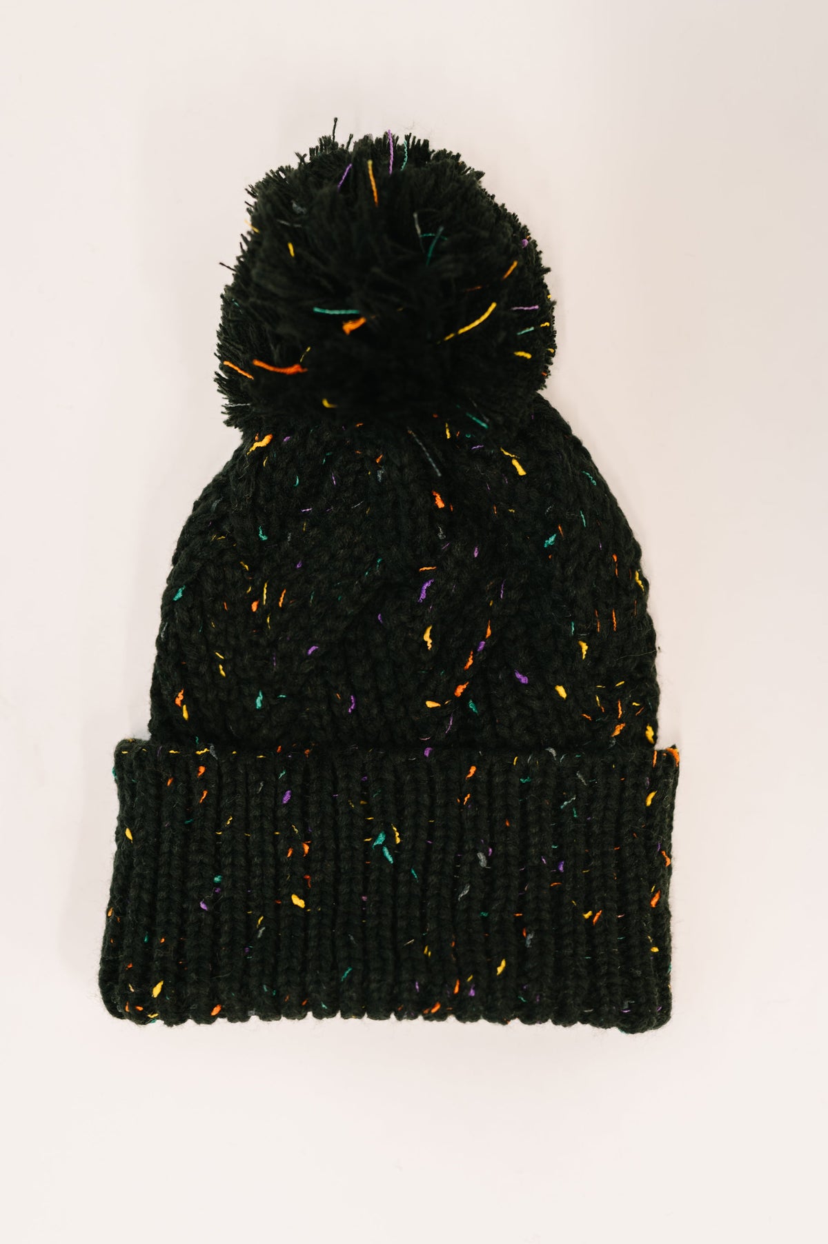 Cover Your Ears Pom Pom Beanie in Black