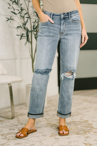 Light blue Ave Shops Elaine mid-rise boyfriend jeans with distressed details and cuffed hems, casual denim style.