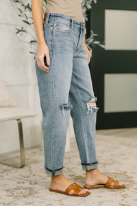 Pair of Ave Shops Elaine mid-rise boyfriend jeans with distressed details and rolled cuffs, showcasing casual, relaxed fit denim.
