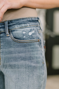 Light blue Elaine mid-rise boyfriend jeans with distressing and rolled cuffs, stylish denim from Ave Shops.
